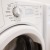 close up of washer/dryer units in apartment