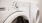 close up of washer/dryer units in apartment