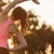woman stretches at outdoor fitness area